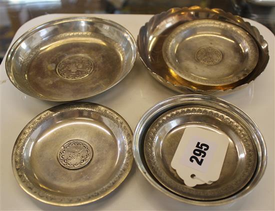 Six Turkish white metal kurus coin-set dishes, various sizes, one inscribed